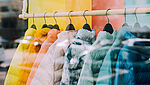 Clothing rack with jackets in rainbow colors