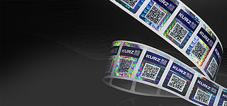 Customized security solutions for your product Security label roll on black ground