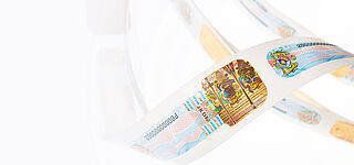 Awarded Tax Stamps protection by TRUSTCONCEPT® Tax Stamps roll on white background