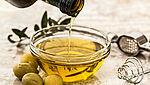 Close-up view of a bowl with olive oil. Is it counterfeit or an authentic product?